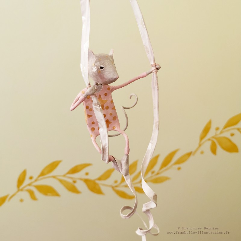 Decorative pink mobile with circus mouse made of papier-mâché